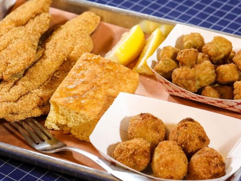 Cornmeal-fried catfish fillets with cornbread, fried okra and hushpuppies